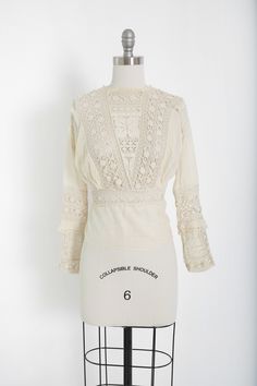 "Stunning Antique vintage early 1900's Edwardian crochet blouse Floral embroidered crochet lace, high neck long sleeve Natural cotton in ivory / cream button down back Great vintage condition - few age spots (see photos) very wearable M e a s u r e m e n t s: Size: fits like a XS S BUST: 18 1/2\" Waist: 13\" Total Length: 22\" Sleeves: 20\" Label: unbranded Fabric: cotton +All Measurements are taking while garment is lying flat+ + Jewelry, belts, and any other accessories are NOT included unless Edwardian Fashion Modern, Edwardian Crochet, Flat Jewelry, Terry Cloth Dress, Embroidered Crochet, Crochet Lace Blouse, Historic Clothing, White Lace Blouse, Leopard Print Skirt