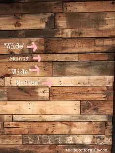 the side of a wooden wall with arrows pointing in different directions and words on it