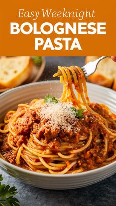 spaghetti with sauce and parmesan cheese in a white bowl on top of a table