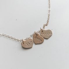 "CUSTOMIZED HEART NECKLACE -A sweet, dainty heart necklace with the option for a single heart or several layered together. // MATERIAL // -Heart is 14 Karat Gold Filled and is approximately 10 mm. 14 Karat Gold Filled is usually a lifetime product, will not tarnish, and is perfect for those with sensitive skin. -Chain is 14 Karat Gold Filled, 16 inches (as seen in the photos with the blush sweater) or 18 inches. // CUSTOMIZATION // -Please include your customization in the box labeled \"Add your Simple Heart Charm Necklace For Wedding, Dainty Hand Stamped Heart Necklaces, Simple Wedding Necklace With Heart Charm, Minimalist Heart Charm Necklaces For Anniversary Gift, Dainty Heart-shaped Hand Stamped Charm Necklace, Dainty Adjustable Necklace For Anniversary Gift, Dainty Hand Stamped Heart Charm Necklace, Dainty Adjustable Necklace For Anniversary, Dainty Hand Stamped Heart Jewelry