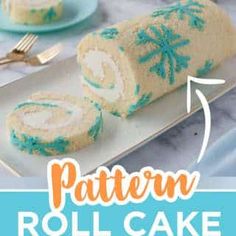 a roll cake with blue frosting is on a plate