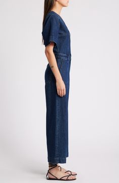 Make it one-and-done in a casual jumpsuit cut from dark-rinsed nonstretch denim. 52" length; 25" inseam; 23" leg opening (size Medium) Front button closure V-neck Short sleeves Front patch pockets 100% cotton Machine wash, tumble dry Imported High Rise Denim Blue Utility Jumpsuit, Dark Wash High Rise Jumpsuits And Rompers With Pockets, High Rise Dark Wash Jumpsuits And Rompers With Pockets, High Rise Dark Wash Jumpsuits With Pockets, Dark Wash Straight Leg Overalls For Work, Dark Wash Full-length Denim Jumpsuit With Pockets, Full-length Dark Wash Denim Jumpsuit With Pockets, Dark Wash Wide Leg Denim Jumpsuit With Pockets, Dark Wash Fitted Wide Leg Jumpsuits And Rompers