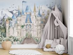 a child's bedroom with a castle mural on the wall and a bed in front of it