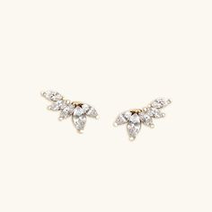 Delicate marquise cut diamond cluster earrings made in 14K yellow gold. Made to Order. Ships within 3-4 weeks. - Stone info: natural diamond, G-H color, SI clarity - Total ct weight: approx. 0.58ct - Finish: Yellow - The earrings come with 14K solid gold backings. - Made in 14 karat gold. - Stamp with 14K. White Diamond Cluster Earrings Marquise Shaped, White Gold Diamond Cluster Earrings With Marquise Cut, Marquise Diamond Cluster Earrings In Fine Jewelry Style, Marquise Diamond Cluster Earrings Fine Jewelry, Classic Marquise Cluster Diamond Earrings, Classic Marquise Diamond Cluster Earrings, Elegant Diamond Cluster Earrings With Marquise Cut, Marquise Diamond Cluster Earrings With Diamond Accents, Elegant Marquise Cut Diamond Cluster Earrings