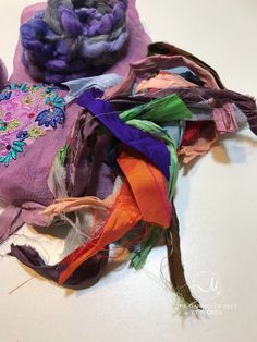 several different colored pieces of fabric on a table