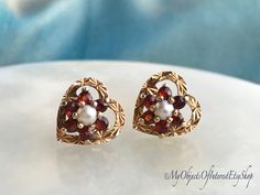 Vintage 9ct Gold Garnet Pearl Heart Stud Earrings Ever so sweet!... Made in the Victorian revival style in 1980.  These fine earrings are suitable to wear  for any occasion...especially Christmas! Each gold heart has star shaped engine  turned decoration for extra sparkle. The central real pearls are surrounded by six  round cut garnets.Good quality... A gorgeous gift for a special someone. Size approx. 1cm diameter London hallmarks for 9ct gold, 1980. 9ct gold butterfly backs In good condition. Hallmarked Heart Earrings For Valentine's Anniversary, Valentine's Day Anniversary Hallmarked Heart Earrings, Classic Hallmarked Earrings For Valentine's Day, Vintage Earrings For Valentine's Day Anniversary, Vintage Heart Earrings For Wedding, Vintage Heart Earrings For Valentine's Day Wedding, Vintage Heart Earrings For Wedding And Valentine's Day, Ruby Bangles, Green Brooch