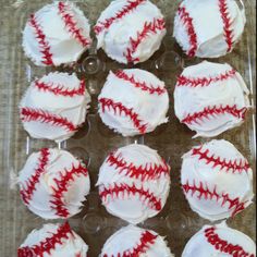 cupcakes with white frosting and red stitches on them are arranged in the shape of baseballs