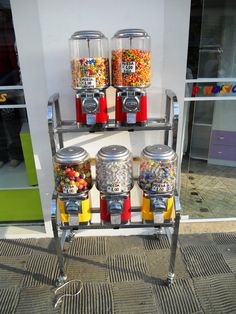 a machine that has some kind of candy dispenser on it's side