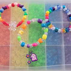 I have been collecting and making kandi since my early rave days in 2000. I will be making special kandi sets that include vintage beads from my collection. Have a little piece of kandi history. I created a playlist on my YouTube channel Kandi Toybox (My kandi bead collection) if you would like to see my collection! These kandi bracelets are made with mostly vintage beads from the 90s,early 2000s and some new beads. New beads are some of the pony beads. Includes 3 bracelets. Bracelet size 7-8 inches  This set is premade and is ready to ship! Perfect for any event! You will get lots of compliments in this unique wearable art! Stand out at your next event! Birthday party  Edm festival  Raves Rave outfit  Festival outfit Pride Stocking stuffer  Party favor  Glow party Rave birthday  Rave anni Rainbow Beaded Bracelets For Rave, Rave Style Plastic Beaded Bracelets, Multicolor Plastic Beaded Bracelets For Rave, Multicolor Plastic Bracelets For Rave, Multicolor Plastic Rave Bracelets, Rave Style Multicolor Plastic Bracelets, Bracelets Kandi, Rave Bracelets, 90s Gift