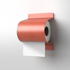 a roll of toilet paper is hanging on the wall