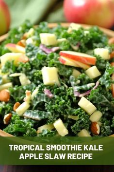 a close up of a bowl of food with apples in the background and text that reads tropical smoothie kale apple slaw recipe