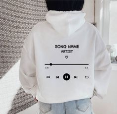 "Custom Playlist Hoodie, Personalized Song Hoodie, Song and Artist Hoodie, Trendy Custom Hoodie, Tumblr Hoodie, VSCO Hoodie, Aesthetic Hoodie ~ Printed in USA ~ ~ Gildan ~ HOW TO ORDER Please review all the pictures for size chart and color options before making a decision. 1) Choose the t-shirt color (see the color chart and message me if the color you want is not available on the drop down) 2) Choose the t-shirt size 3) Choose the design/text color (Black or White) 4) Choose the quantity 5) Cl Hoodie Print Ideas, Custom Hoodies Ideas, Artist Hoodie, Hoodie Design Ideas, Vsco Hoodie, Hoodie Personalized, Cool Shirt Designs, Hoodie Aesthetic, Trendy Hoodies