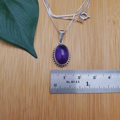 "Visit our on-line shop at: Etsy.com/shop/AlbuquerqueDesigns *sterling silver pendant necklace *gemstone pendant with silver box chain necklace 18\" *southwestern jewelry *amethyst / purple gemstone *calibrated pre-cut stones: 14x10mm oval shape *back of jewelry items are all covered / do not show the back of stones *all jewelry items are made to ship, slight variations in stones will occur comparing to pictures. *size of a penny is 19mm or a dime is 18mm in diameter for comparing size with jewe Stamped 925 Amethyst Necklaces, Nickel Free Purple Sterling Silver Necklace, Purple Sterling Silver Oval Pendant Necklace, Nickel-free Purple Sterling Silver Necklace, Purple Sterling Silver Necklace For Gift, Purple Sterling Silver Necklace As Gift, Oval Purple Sterling Silver Necklace, Purple Necklace Stamped 925 As Gift, Turquoise Heart Earrings