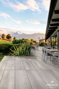 an outdoor dining area with tables and chairs