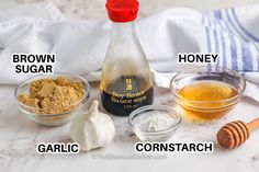 ingredients to make honey syrup on a marble countertop