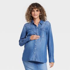 This Long-Sleeve Western Chambray Maternity Button-Down Shirt from Isabel Maternity by Ingrid & Isabel™ will be your favorite piece to wear during your pregnancy. Tailored in a casual fit, this long-sleeve shirt features a collared neckline, button-down front, buttoned cuffs and chest patch pockets for a sleek and functional style. The lightweight lyocell fabric offers comfortable wear, and you can coordinate it with different pants or shorts to create a range of versatile looks. Medium Wash Long Sleeve Shirt With Snap Buttons, Medium Wash Long Sleeve Top With Button Closure, Long Sleeve Medium Wash Shirt For Workwear, Medium Wash Long Sleeve Blouse With Relaxed Fit, Lyocell Fabric, Maternity Tunic, Functional Style, Maternity Tank Tops, Tunic Tops Casual