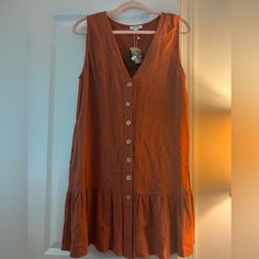 Size Medium, New With Tags. Orange Buttoned Dresses For Fall, Orange Vacation Dresses With Buttons, Orange Beach Dress With Buttons, Orange Fall Dresses With Buttons, Fall Orange Buttoned Dresses, Orange V-neck Dress With Buttons, Brown V-neck Mini Dress With Buttons, Casual Orange Button-up Dress, Peach Lace Dress