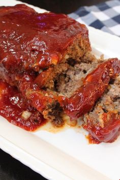 meatloaf with marinara sauce on a white plate