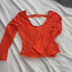 Never Worn!! Guess Open Back/ Ties In The Back Looks So Pretty On!! Pretty Spring Color Stretch Orange Top For Day Out, Stretch Orange Tops For Day Out, Orange V-neck Top For Day Out, Orange Summer Tops With Built-in Bra, Feminine Orange V-neck Top, Orange Printed V-neck Blouse, Orange Floral Print V-neck Top, Spring Color, Spring Colors