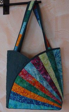 a multicolored bag hanging on the wall