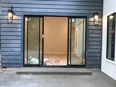 an empty room in the middle of a house being remodeled with new windows and doors