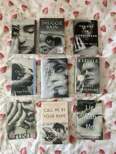 six books are laid out on a bed with pink flowers and white sheets, one is titled the little matchmaker