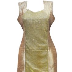 a gold and beige dress on a mannequin