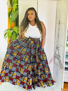 Slip into easy sassiness with this African Print maxi skirt. Has pockets. This comfortable skirt has an elastic waistband with 2 straps and should fit up to a 2X waist. Length is 42". 100% cotton. Hand wash in cold water. Warm iron. African Maxi Skirt, Maxi Skirt With Pockets, African Ladies, African Print Maxi Skirt, African Print Skirt, Comfortable Skirts, Print Maxi Skirt, Printed Maxi Skirts, Skirt With Pockets