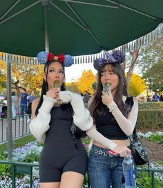 two women dressed up as mickey and minnie mouse