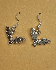 Cute little bats fluttering around at the end of a surgical stainless steel ear wire. For the dark side in all of us, what better way to say "Batty", than this.Any metals used in jewelry are all nickel free, tarnish resistant (except for copper, which will change color(patina) over time). Metals are either bare copper, silvertone, or goldtone, unless otherwise stated. Nickel-free Adjustable Surgical Steel Jewelry, Adjustable Nickel-free Surgical Steel Jewelry, Gothic Hypoallergenic Metal Jewelry, Nickel-free Themed Stainless Steel Jewelry, Themed Nickel-free Stainless Steel Jewelry, Gothic Silver Surgical Steel Earrings, Gothic Sterling Silver Hypoallergenic Earrings, Gothic Hypoallergenic Sterling Silver Earrings, Adjustable Nickel-free Earrings For Halloween