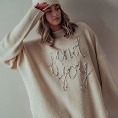 Dress in ultimate comfort and style with The Joy Oversized Knit Sweater. This cozy sweater features long sleeves, a crew neck line, and side slits for a relaxed fit. The standout feature is the "find joy" embroidery design, adding a touch of positivity to your wardrobe. Perfect for staying warm and stylish all fall and winter long. Fabric: 74% ACRYLIC 22% POLYESTER 4% SPANDEX Fit: True to size | Oversized - size down for smaller fit S fits sizes 2-6 M fits sizes 6-10 L fits sizes 10-14 Model is Joy Embroidery, Oversized Knit Sweater, Fall Transition, Oversized Knitted Sweaters, Find Joy, Oversize Knit, Cozy Sweater, Finding Joy, Cozy Sweaters