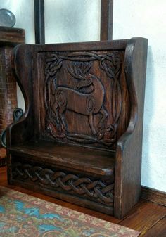 a wooden bench sitting on top of a rug