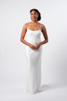 An elegant minimal gown in the most luxurious heavy silk crepe with a low back and train. The bias cut gives the fabric a natural stretch so it just slips on and moves with you. This dress is fully lined in the same silk crepe and feels amazing to wear. -100% Silk crepe- Weight 40mm -Simple slip wedding dress -No zip -Round neck front -Spaghetti straps -Individually cut and made in New Zealand -Made order in standard & split sizes NZ/AU/UK 6-20 ORDER INFO Production time is 4-6weeks - contact us Fur Wedding Dress, Slip Wedding Dress, Veil Accessories, Dress With Train, Wedding Veil Accessories, Bridal Tops, Bridal Fabric, Brides Wedding Dress, Wedding Dress Shopping