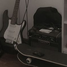 an electric guitar and amp in a room