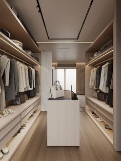 an empty walk in closet with lots of clothes