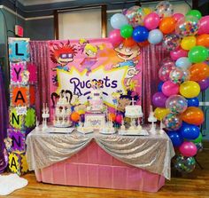 a birthday party with balloons and decorations