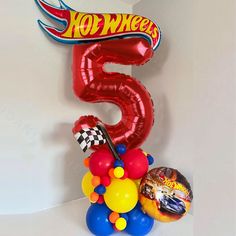 the balloon number five is surrounded by balloons