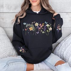 Wildflower designs printed on front, back and sleeves Spring Letter Print Hoodie Sweater, Hooded Hoodie With Floral Embroidery For Spring, Vintage Hooded Hoodie For Spring, Casual Hooded Hoodie With Floral Embroidery, Spring Crew Neck Sweater With Drawstring Hood, Vintage Long Sleeve Hoodie For Spring, Oversized Floral Print Sweatshirt For Spring, Spring Vintage Hoodie With Relaxed Fit, Floral Embroidery Long Sleeve Hoodie For Fall