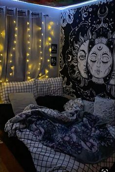 a bed room with a neatly made bed and string lights