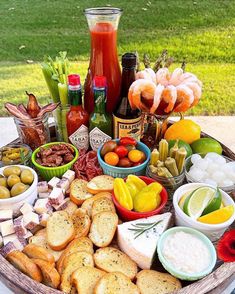 a platter filled with different types of food and condiments on a table