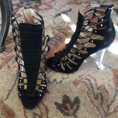 These L.A.M.B. Black Stiletto Sandals Have A Small Platform Toe. They Are Made Of Suede With Elasticized “Strings” To Expertly Form To Your Foot. Never Worn But Have Some Slight Markings On One Heel. Can Be Buffed Out. See Photos. White Heel With Lucite At Top. 4.5” Heel With .5” Platform. Black Party Sandals For Fall, Designer Heels For Spring Night Out, Designer Lace-up Heels For Night Out, Designer Medium Width Party Heels, Black Stilettos, White Heels, Stiletto Sandals, Gwen Stefani, Top 4