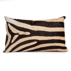 a zebra print pillow on a white background