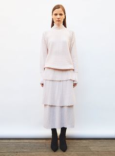 this ruffled pointelle knit skirt is made in italy in a light, delicate openwork knit that resembles lace. it stands out thanks to its ultra-feminine cut in three light flounces for a couture effect. in a "petal" color, wear this knit skirt in any season paired with molli's high-collared, pointelle knit top for a sophisticated total look accessorized with jewelry.  the model is 1.78 m tall and wears a size s. Ultra Feminine, Pointelle Knit, Total Look, Knit Skirt, High Collar, Knit Top, Couture, Italy, Knitting