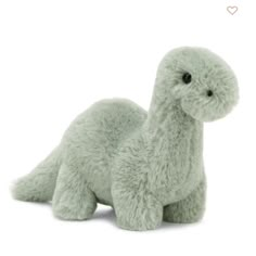 a green stuffed animal on a white background