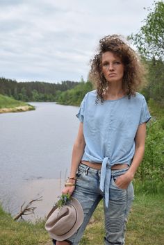 "Excellent denim blouse for your midsummer nights. It is not a mistake - buttons are on the back! Size: label says S, seems like women's (S) MEASUREMENTS: Length: 57 cm/ 22\" (without ties) Shoulder to shoulder: 50 cm/ 20\" Chest: 116 cm/ 46\" Condition: excellent Fabric: Lyocell Brand: unknown * Wash at temperature not higher than 30oC / 86oF Model wears: UK 8/ EU 36/ US 4 Model's height: 175 cm/5'7\" You can find more similar shirts here: https://www.etsy.com/shop/OnTheRoadStore?section_id=239 Summer Denim Blue Top With Short Sleeves, Short Sleeve Denim Top For Summer, Light Indigo Short Sleeve Denim Top For Summer, Denim Beach Top With Short Sleeves, Beach Denim Short Sleeve Top, Indigo Denim Shirt For Summer, Light Wash Short Sleeve Denim Top For Summer, Summer Indigo Denim Shirt, Indigo Short Sleeve Denim Top For Summer