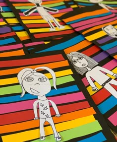 children's paper cutouts are arranged on colorful strips with one girl and the other boy