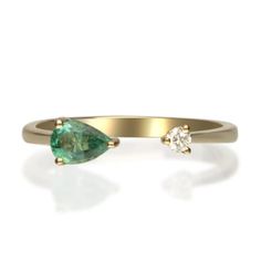 Stunning, timeless and classy eternity Unique Ring. Decorate yourself in luxury with this Gin & Grace Ring. The 14k Yellow Gold jewelry boasts Pear-Cut Prong Setting Natural Emerald (1 pcs) 0.32 Carat, along with Natural Round cut white Diamond (1 Pcs) 0.05 Carat, accent stones for a lovely design. This Ring is weight 2.0 grams. Crafted with 14k Yellow Gold, this delicate Ring is polished to a high finish shine. Elegant 14k Gold Emerald Ring With Round Band, Formal Fine Jewelry Emerald Ring With Single Cut Diamonds, Green Open Band Elegant Rings, Elegant Green Open Band Rings, Elegant Pear-shaped Emerald Ring, Elegant 14k Gold Emerald Promise Ring, Elegant Emerald Ring With Round Band For Promise, Anniversary Rings With Single Cut Diamonds For May Birthstone, Elegant Green Open Band Jewelry