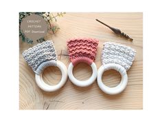 three crochet patterns for knitted hair accessories on top of a wooden table