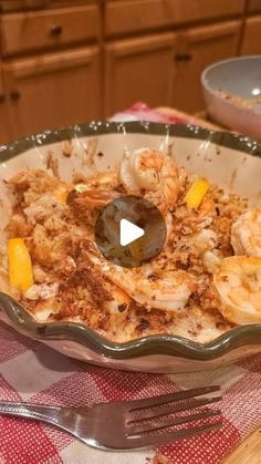 a bowl filled with food sitting on top of a table