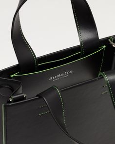 Compact and modern, the Tote is the perfect unisex everyday bag. The detachable shoulder strap allows a cross-body or hand carry, and its body can easily hold an iPad, a notebook, and all essentials you need. Any question ?Email us support@audette-shop.comChat with us via WhatsApp Details - Vegan cactus fiber from Mexico- Flashy Green linings and stitchings - Inner pocket - Magnetic top closure - Polished silver hardware- Embossed audette logo Dimensions- w 21 x h 25 x d 8 cm (8,26 x 9,84 x 3,14 in)- Shoulder drop 45 cm (17,71 in) Shipping Info Modern Briefcase Tote With Adjustable Strap, Modern Briefcase With Detachable Handle And Crossbody Shape, Modern Crossbody Briefcase With Top Handle, Modern Everyday Crossbody Briefcase, Modern Crossbody Briefcase For On-the-go, Modern Briefcase With Detachable Strap For On-the-go, Modern Crossbody Briefcase For Daily Use, Modern Briefcase With Adjustable Strap For Daily Use, Modern Briefcase With Adjustable Strap